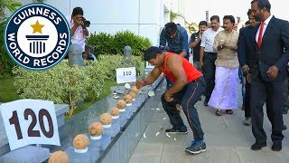 Most coconuts smashed in a minute  Guinness World Records [upl. by Erodisi115]