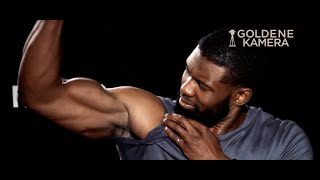 Trevante Rhodes flexes to prove a point about his muscles in Predator interview [upl. by Fonseca]