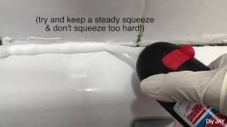 Applying the Unibond sealant in the bath [upl. by Iahs]