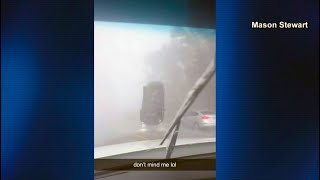 Video captures wind gust flipping car upside down on another vehicle [upl. by Erickson]