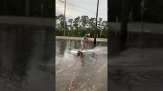 Tow surfing through flooded street [upl. by Anilrac]