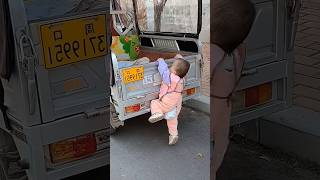 Oneyearold baby is very good at getting in the car funny cutebaby [upl. by Anaeirb]