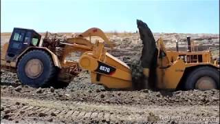 CAT 657 Scrapers Digging New Landfill Cell [upl. by Ellenwad969]