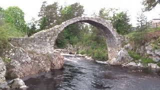 The famous historic 1719 built stone packhorse bridge at Carrbridge Highland Scotland [upl. by Airitak54]