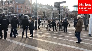 Demonstrators Gather In Amsterdam To Protest Netherlands COVID19 Restrictions [upl. by Elyc517]