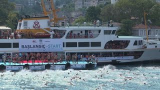 Thousands cross continents in Istanbul swim race [upl. by Mcclimans]