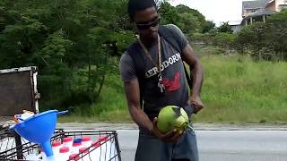 Chopping coconuts with a machete  Buying coconuts in Barbados [upl. by Aehcsrop7]