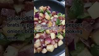 Smoked cheddar brats and potatoes with onions and green peppers brazed with red cooking wine [upl. by Delfeena159]