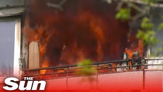 Firefighters race against time after Russian strike on residential building in Kharkiv [upl. by Haleeuqa184]