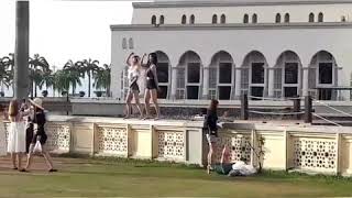 Tourists dance near the mosque [upl. by Arobed904]