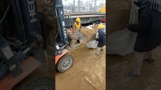 A forklift loads sand into a bag [upl. by Maybelle60]