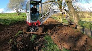 Cutting Paths Into A Hill Side With A Mini Digger Takeuchi TB216 Excavator [upl. by Znieh587]