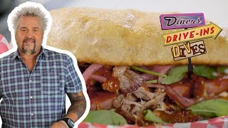 Guy Fieri Takes Down the Porkcules Sandwich  Diners DriveIns and Dives  Food Network [upl. by Znarf]