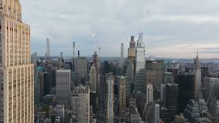 The sunlight slowly illuminates the skyscrapers of midtown Manhattan with the Empire State Building [upl. by Balmuth]