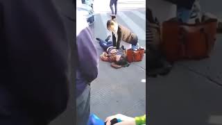 CPR on woman in the street [upl. by Remlap]