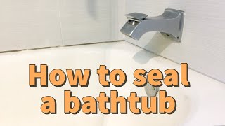 HOW TO SEAL AROUND A BATHTUB  how to replace silicone bath  how to re caulk a bathtub [upl. by Parcel]