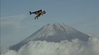 Jetman flies over Mount Fuji Yves Rossy soars over Japanese volcano using jet pack [upl. by Rendrag922]