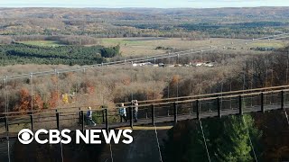 Worlds longest timbertowered suspension bridge opens in Michigan [upl. by Kaliski]