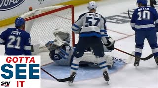 GOTTA SEE IT Jets Hellebuyck Cut By Kucherov Slap Shot To Face [upl. by Aihsoem287]