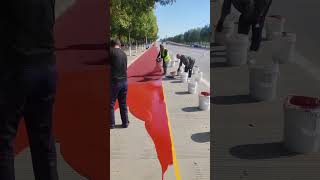 Antislip colored ceramic particle laying process for the concrete road [upl. by Alaek]