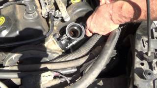 How to replace a Thermostat on a 1997 Plymouth Neon [upl. by Neersin]