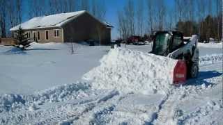 Bobcat 770 with a 10foot snow pusher  Matts Tree Service [upl. by Ahsik466]