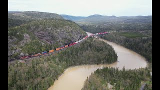 Across the bridge and along the lake AERIAL  CPKC train 10125 at Neys Ontario Canada [upl. by Casanova]