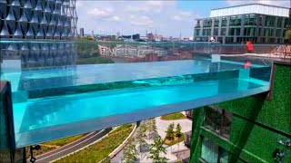 SKY POOL LONDON EMBASSY GARDENS THE WORLDS FIRST FLOATING POOL TRANSPARENT POOL 115 FEET HIGH [upl. by Mellisa]