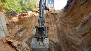 Excavator Digging A Borrow Pit [upl. by Anrev773]