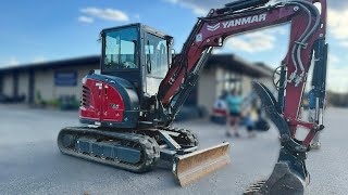 Yanmar SV40 digging out a big rock [upl. by Idissac]