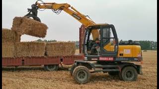 excavator loader backhoe grabber lift handler grass hay bale alfalfa biomass machinery [upl. by Weksler374]