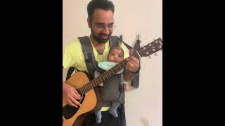 Baby enjoying father singing song on guitar [upl. by Drofliw]