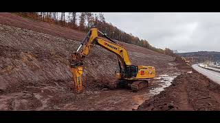 CAT 395 NextGen with EPIROC EPH 10000 crushing rock [upl. by Anoirb]