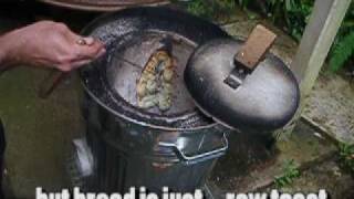 cooking naan bread in a homemade trash can wood fired tandoor oven  tandoori [upl. by Robinetta914]