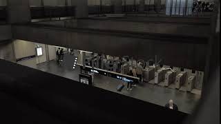 A top view of people walking through automatic turnstiles [upl. by Tyrrell]