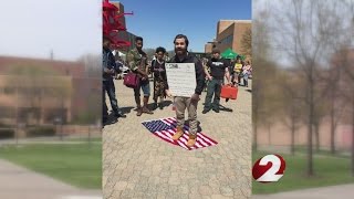 Protester stands on American Flag causes uproar at Wright State [upl. by Elstan105]