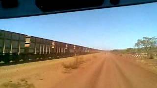 Roadtrain meets empty ore train Marandoo East Pilbara [upl. by Boehmer]