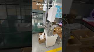 Automatic Hang tag sticker Attach vietnam  automationtechnology apparel [upl. by Lacsap]