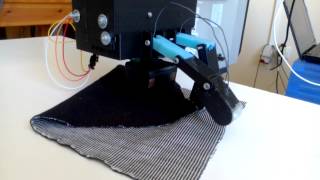 Underactuated robotic gripper  Unfolding a folded piece of fabric [upl. by Mitzie]