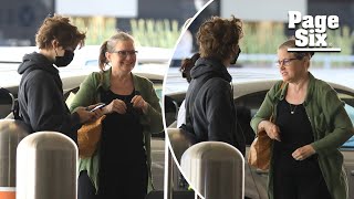 Bridget Fonda arrives at LAX with son Oliver Elfman in rare sighting [upl. by Jorry]