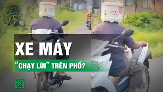 Đội nồi cơm điện điều khiển xe máy “đi lùi” trên phố  VTC14 [upl. by Nolyk]