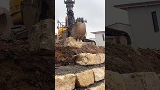 Limestone retaining wall construction process [upl. by Kalmick]