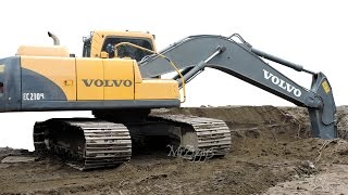 Excavator Digging Dirt Loading Dump Truck Volvo EC210B [upl. by Nnyleuqcaj]