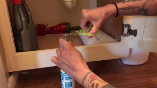 Caulking a sink caulking under a sink apply caulking to bathroom sink [upl. by Engedi]