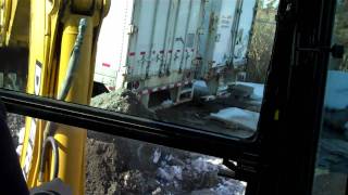 310e backhoe moving stone [upl. by Kopple]