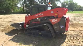 Kubota SVL 972 spreading topsoil Harley raking seeding erosion control putting in a lawn [upl. by Aniloj]