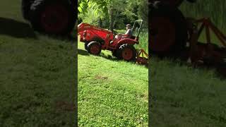 Kubota Tractor Mowing Steep Hill with my Finish Mower tractor mower tractorattachments [upl. by Carberry]