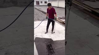 The process of painting a concrete surface with bitumen paint under high pressure [upl. by Atims]