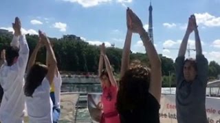 France prepares for yoga at the Eiffel Tower [upl. by Eornom]