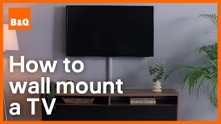 How to mount a TV to a wall  DIY [upl. by Ainessej]